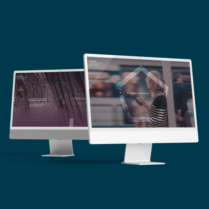 Two angled monitors showing Cripps landing page imagery.